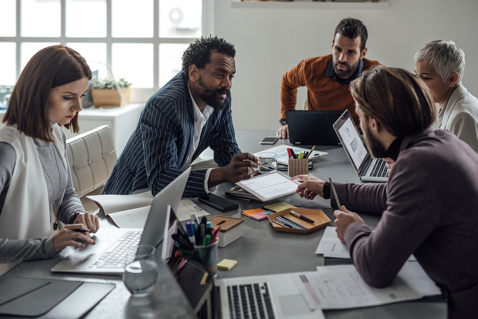 Group of people in office collaborating in meeting