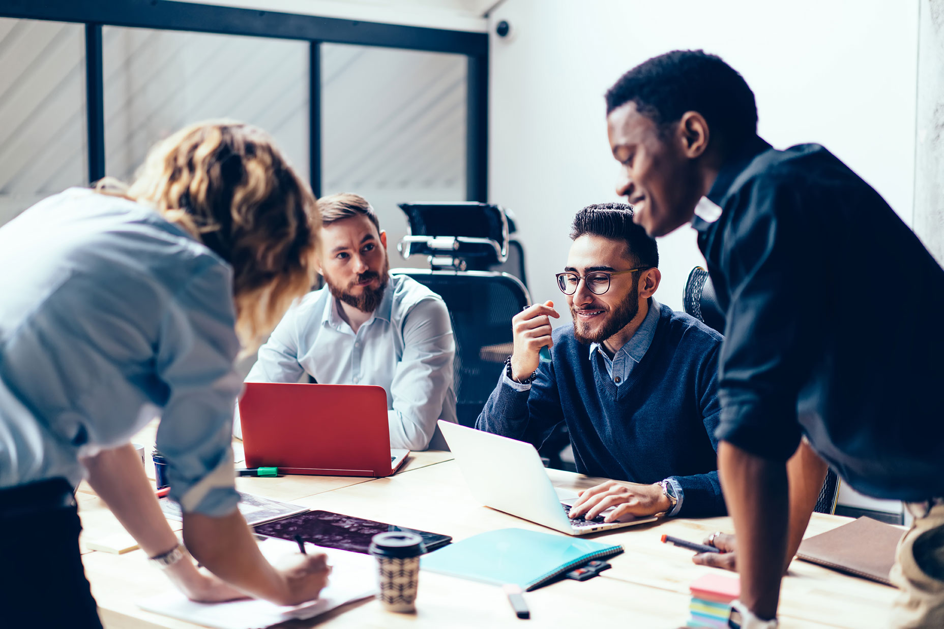 Group collaborating at office table